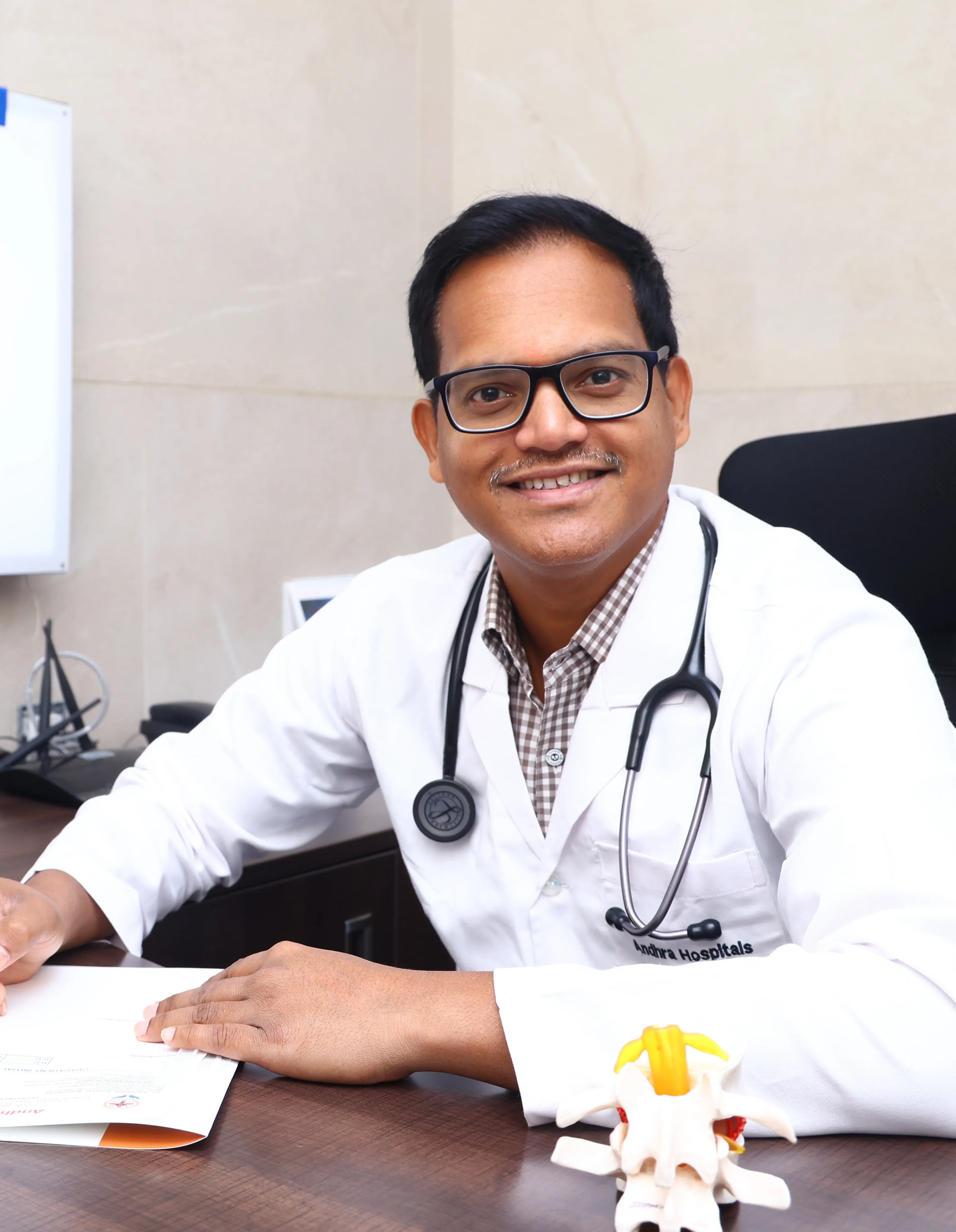 Dr. Sandeep Kanugula consulting patient in Visakhapatnam